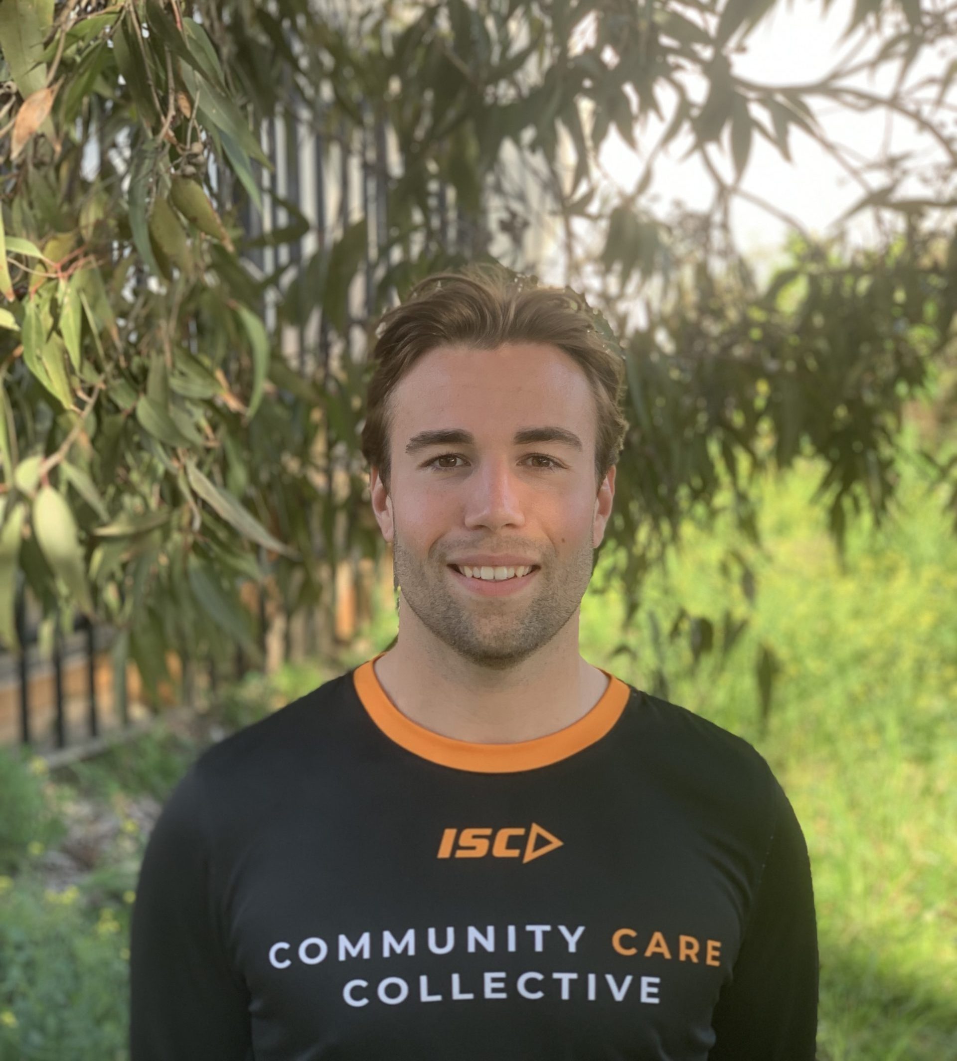 Community Care Collective Team All smiles playing basketball with