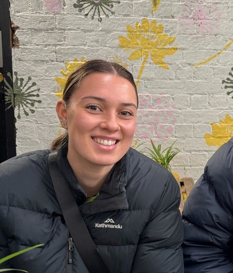 Community Care Collective Team All smiles playing basketball with